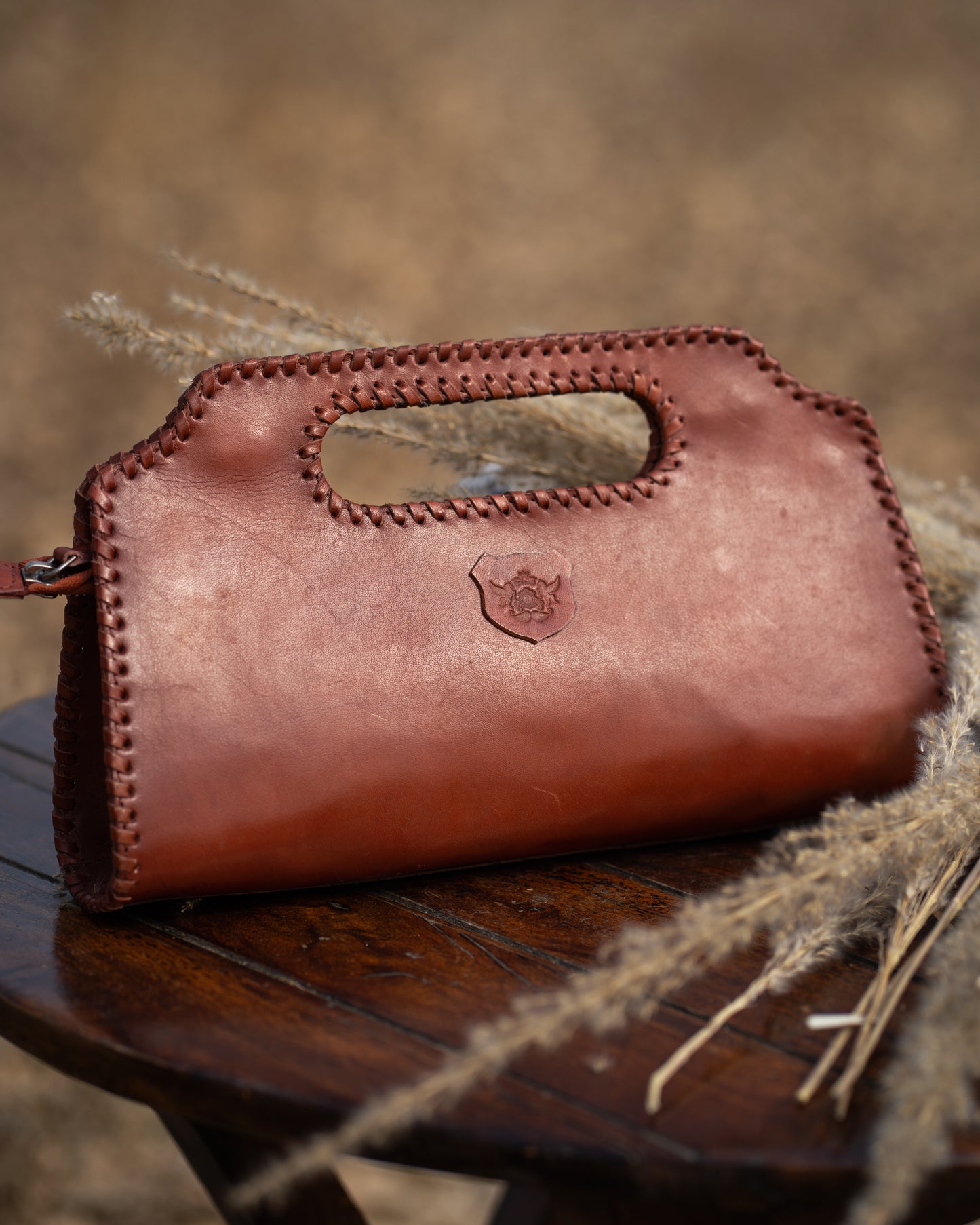 FloMotif Ruby Leather Tooled Clutch